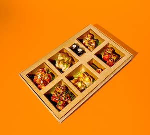Craft-casual pan-Asian delivery aesthetic — supporting dish in this style