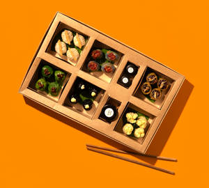 Craft-casual pan-Asian delivery aesthetic — supporting dish in this style